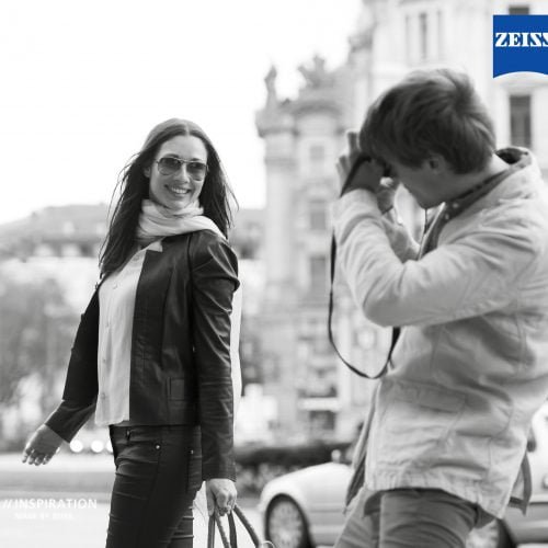Man photographing a woman
