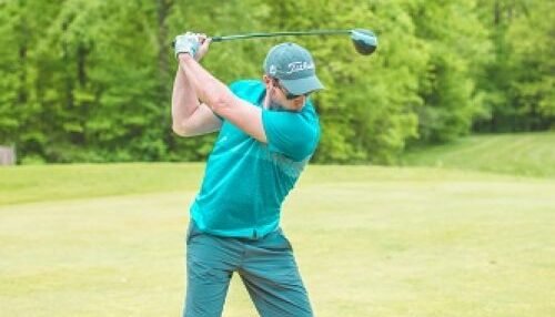 Image of a male golfing