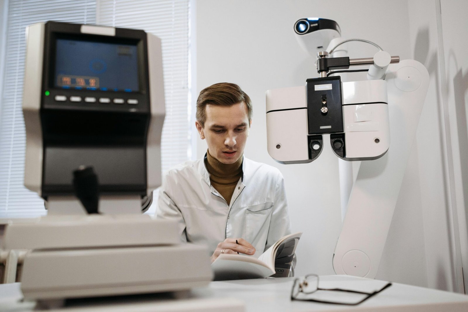 Image of an optometrist reading a booklet