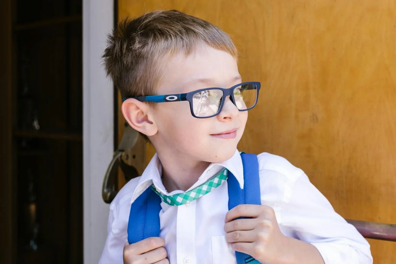 Image of a young child wearing glasses