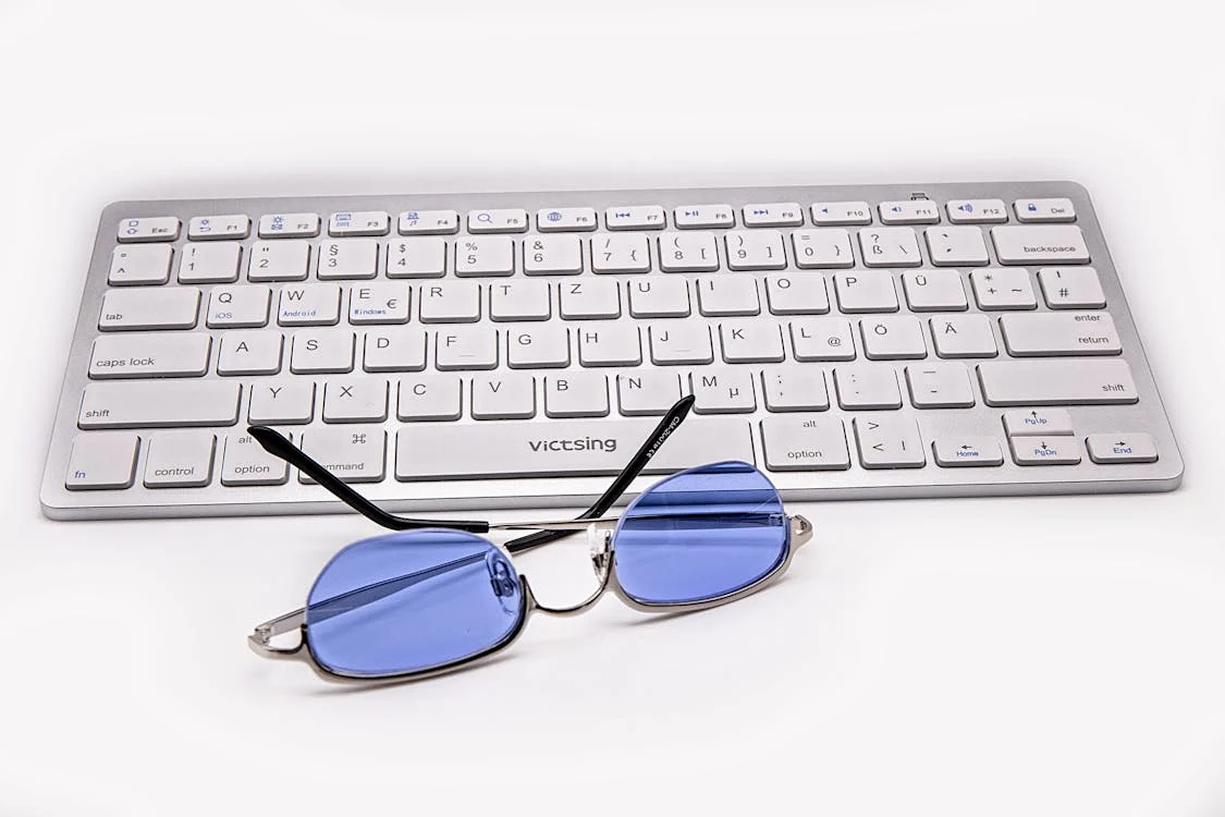 blue light glasses and keyboard